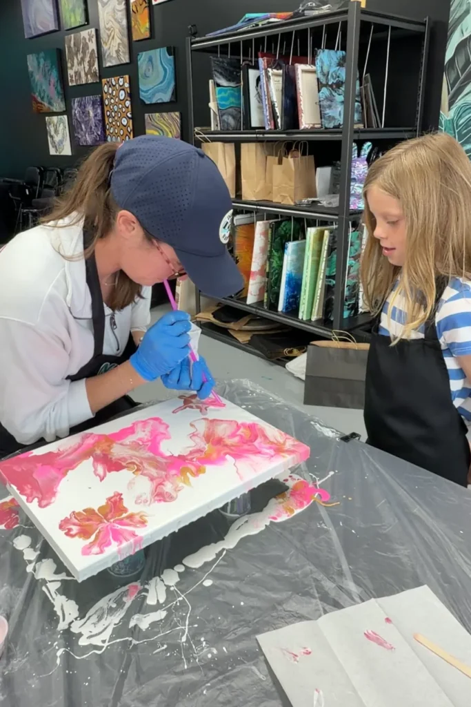 parent-child-blowing-fluid-art-canvas-naperville-2x3